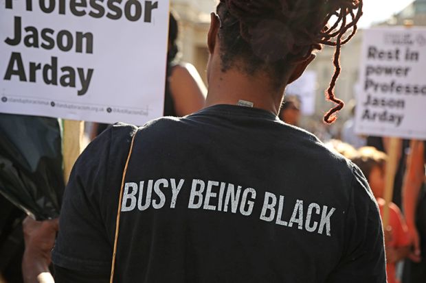 An attendee, wearing a T-shirt stating “busy being black”, holds a placard during a vigil for former Cambridge professor Jason Arday in Trafalgar Square on 17 August 2026 in London, United Kingdom. An attendee, wearing a T-shirt stating “busy being black”, holds a placard during a vigil for former Cambridge professor Jason Arday in Trafalgar Square on 17 August 2026 in London, United Kingdom.