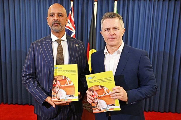 Race discrimination commissioner Giridharan Sivaraman (left) and education minister Jason Clare (right) are seen during a press conference to release the Racism@Uni report at the Commonwealth Parliamentary Offices (CPO) in Brisbane, 17 February 2026.