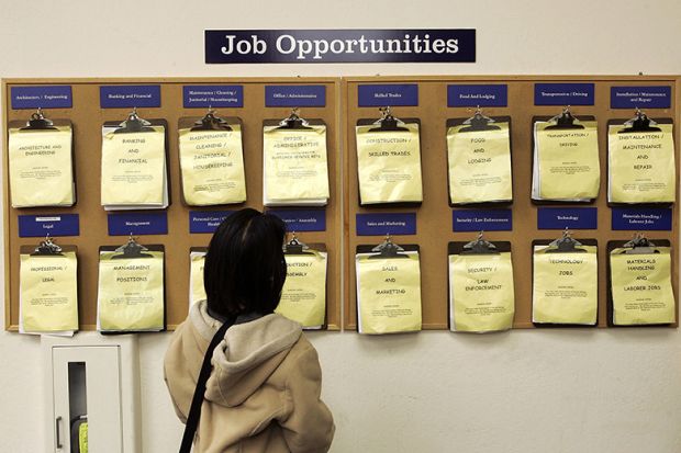 A job seeker looks at a job listing board. To illustrate a proposal from Universities UK (UUK) that all undergraduates should get work-based learning.