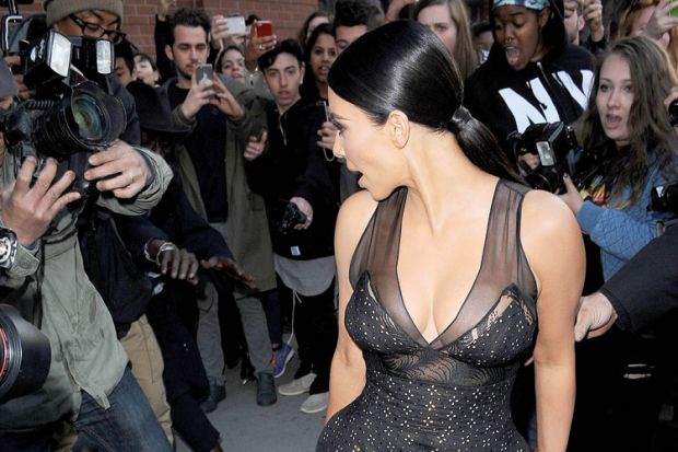 Kim Kardashian posing for photographers and fans