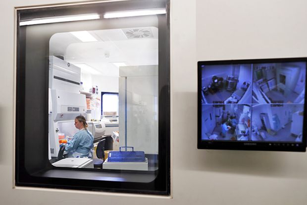 Screen showing cctv outside a laboratory door. To illustrate the need for ‘tougher’ research security measures and more resources to guard against espionage risks. Screen showing cctv outside a laboratory door. To illustrate the need for ‘tougher’ research security measures and more resources to guard against espionage risks.