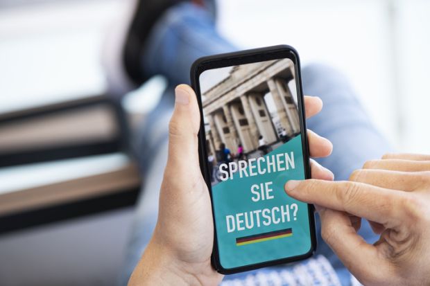 German language lesson on a smartphone illustrating a story about language proficiency in Germany universities