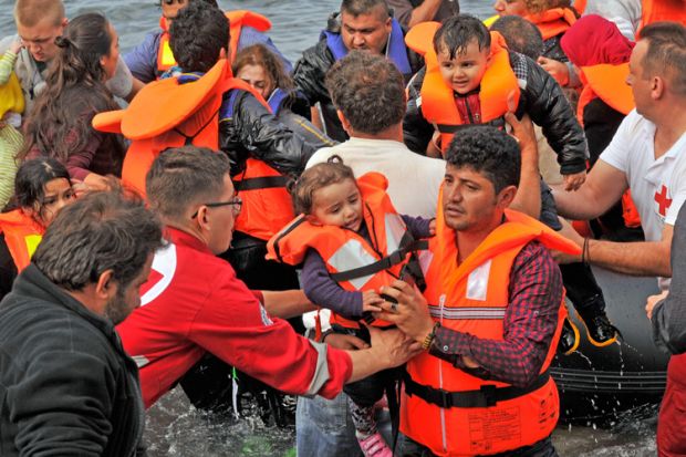 Volunteer rescuers helping refugees on Lesvos in Greece