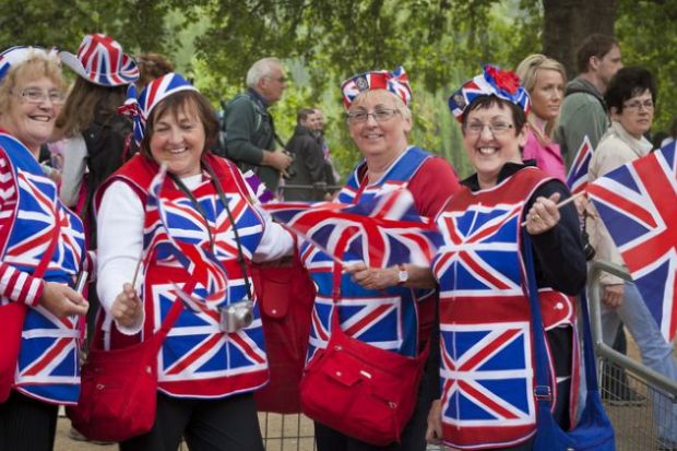 London, England - April 29, 2011 Group of women in fancy dress outfits standing along The Mall in Westminster, join the thousands of well-wishers from around the world to celebrate the Royal Wedding