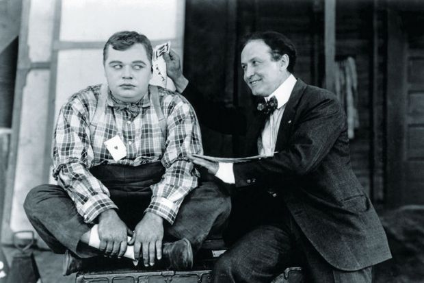 Magician performing card trick Magician performing card trick