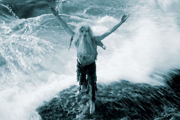 Man marooned on rock in ocean