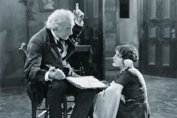 Man pointing up with young woman Man pointing up with young woman