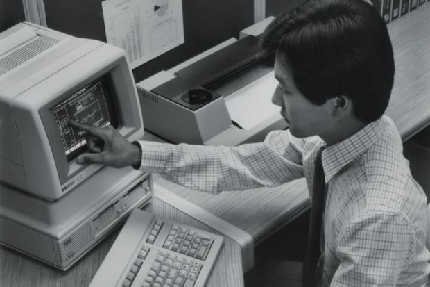 Man using Hewlett Packard HP-150 touchscreen computer