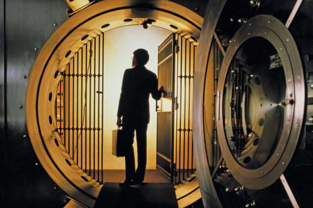 Man walking into bank vault Man walking into bank vault