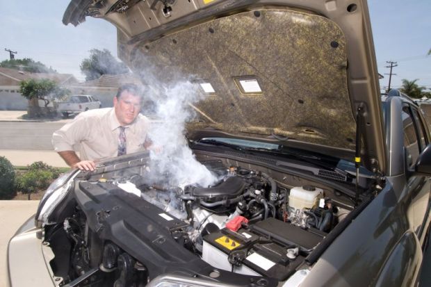 Man with overheating car