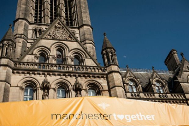 A banner on Manchester town hall reading "Manchester Together", commemorating the anniversary of the Manchester Arena bomb. A banner on Manchester town hall reading "Manchester Together", commemorating the anniversary of the Manchester Arena bomb.