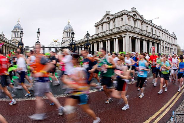 Runners pass by the University of Greenwich during the London Marathon. To illustrate accelerated degrees.