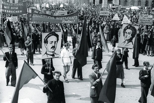 Supporters of Karl Liebknecht and Rosa Luxemburg march in the May Day parade in 1948
