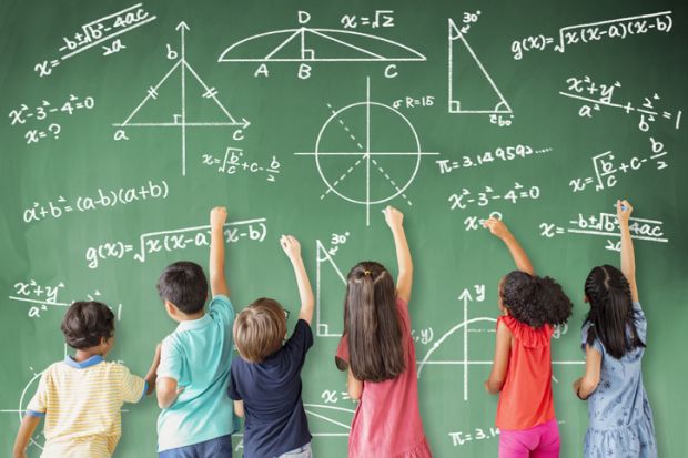 Girls and boys do mathematics on a school blackboard, symbolising gender equality