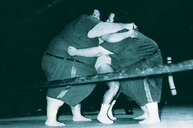 McGuire brothers squashing smaller wrestler