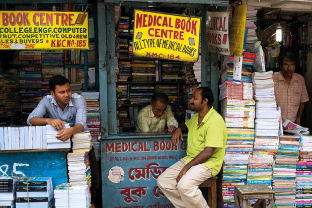 Men looking after book stalls, College Street, Kolkata, India