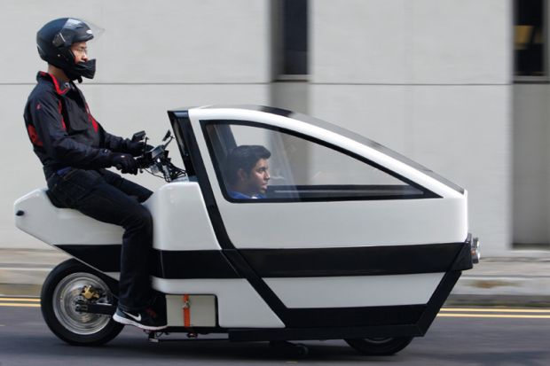 Men riding prototype of VOI electric scooter, Nanyang Technological University (NTU)