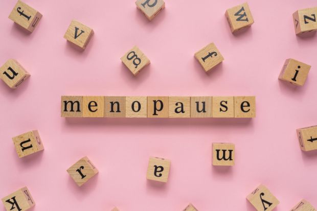 Scrabble tiles reading "menopause"