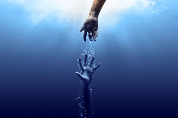 A hand reaches for another one underwater, symbolising a mental health intervention