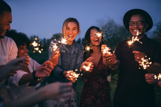 A group of millennials with sparklers