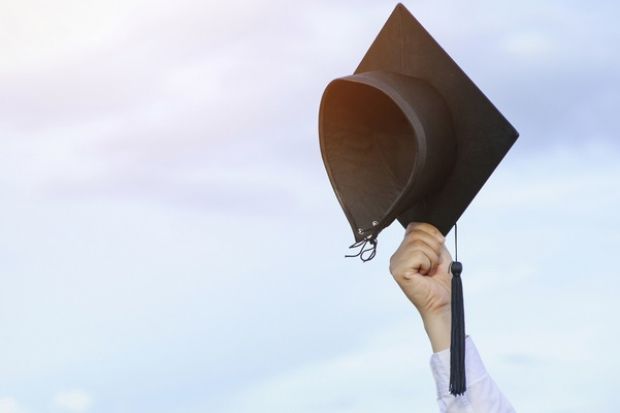 A mortarboard in the air