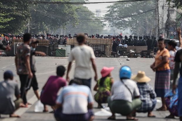 Myanmar riot police blocked the road in front of the protesters during a protest against the military coup in Yangon, Myanmar on March 3, 2021. Myanmar riot police blocked the road in front of the protesters during a protest against the military coup in Yangon, Myanmar on March 3, 2021.