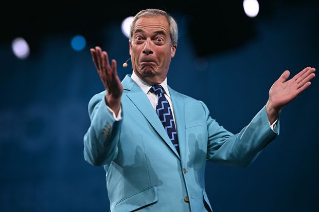 Reform UK Leader Nigel Farage reacts while performing on the first day of the Reform UK party conference at the NEC Birmingham, central England, on 5 September, 2025
