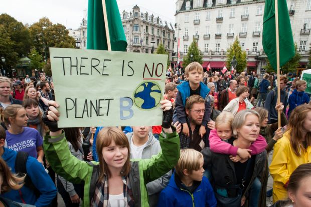 Oslo, Norway - September 21, 2014 A sign reads, There Is No Planet B, as parents carry children among thousands marching through central Oslo, Norway, to support action on global climate change, September 21, 2014. According to organizers of The People's 