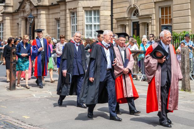 Oxford, England - June 19, 2013 Official proctors and Academics process along Catte street to All Souls College of Oxford University at graduation day