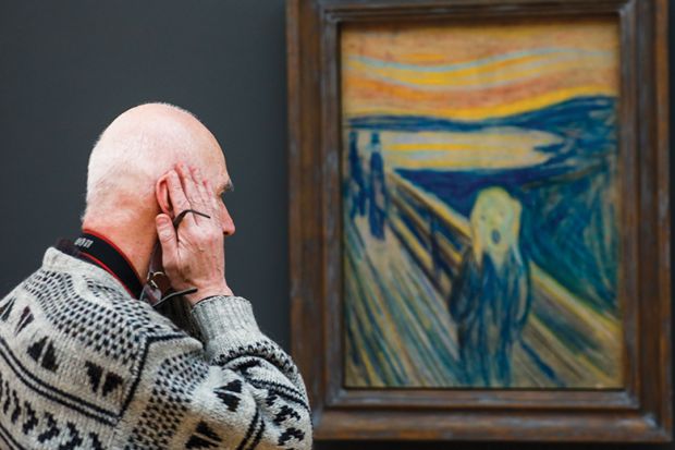 A visitor looks at ‘The Scream’ by Edvard Munch at the Tretyakov Gallery, illustrating a review of ‘Why We Are Restless: On the Modern Quest for Contentment’ by Benjamin Storey and Jenna Silber Storey