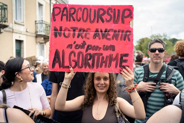 A high school student holds a red placard reading PARCOURSUP OUR FUTURE IS NOT AN ALGORITHM during a high school and university student demonstration in France A high school student holds a red placard reading PARCOURSUP OUR FUTURE IS NOT AN ALGORITHM during a high school and university student demonstration in France