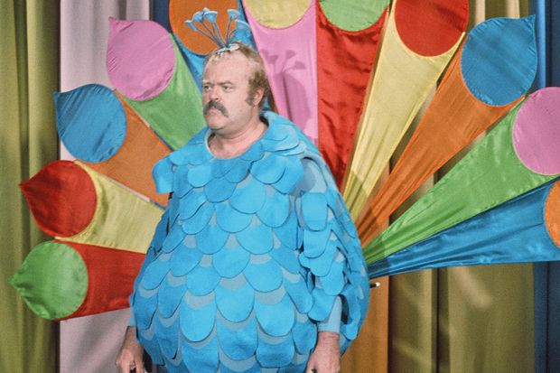 Man in peacock costume