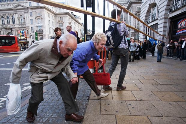 Pensioners lowering themselves to walk under a ladder. To illustrate that employer contribution rates to the Teachers’ Pension Scheme (TPS) may fall by as much as 10 per cent next year. Pensioners lowering themselves to walk under a ladder. To illustrate that employer contribution rates to the Teachers’ Pension Scheme (TPS) may fall by as much as 10 per cent next year.