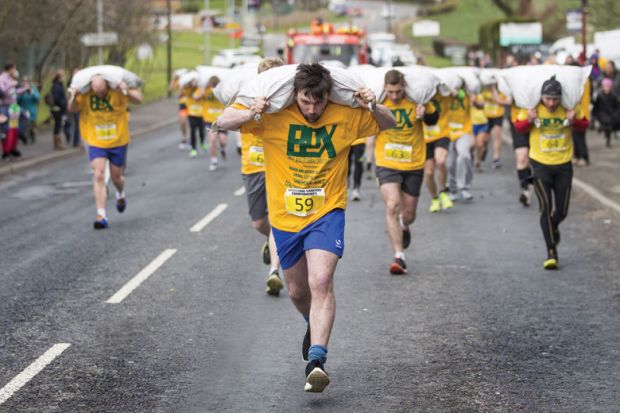 People running in World Coal Carrying Championships, Yorkshire People running in World Coal Carrying Championships, Yorkshire