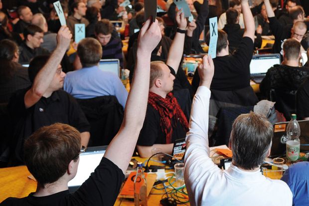 A crowd of people voting A crowd of people voting