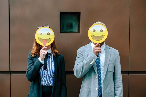 People with emoji masks