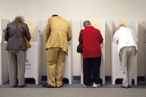 A row of people voting