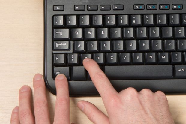 Person pressing Ctrl-Z on PC computer keyboard