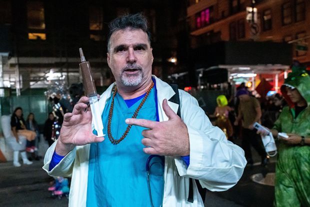 Person wearing a doctor's costume at the Halloween Parade in New York. To illustrate students obtaining fake doctor's notes.