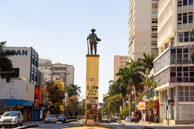 the statue that is right in the middle of Praça do Bandeirante in Goiania. Praça do Bandeirante em Goiânia. Bandeirante Square in Goiania. With the text "The government kills. Bolsonaro Out", painted