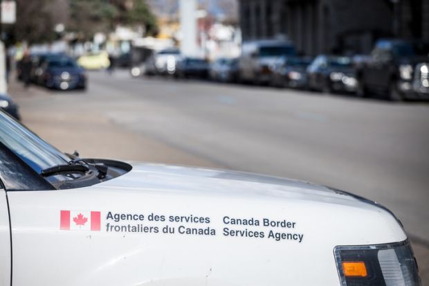 Picture of the logo of Canada Border Services Agency on one of their cars in the port of Montreal. Also known as agence des services frontaliers du canada, or CBSA, it is a federal agency that is responsible for border enforcement, immigration enforcement