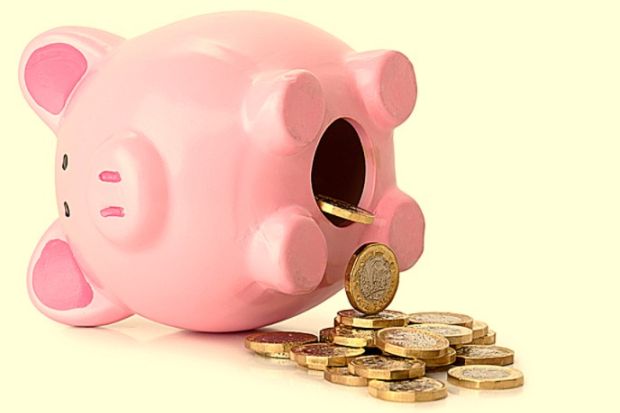 A piggy bank on its side with coins pouring our, illustrating pension unsustainability