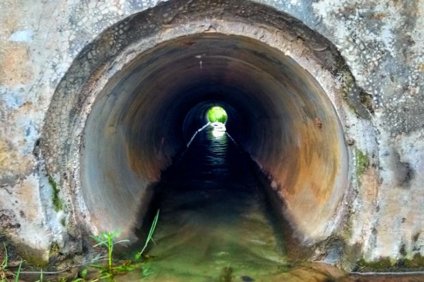 A narrowing pipe with water flowing through it