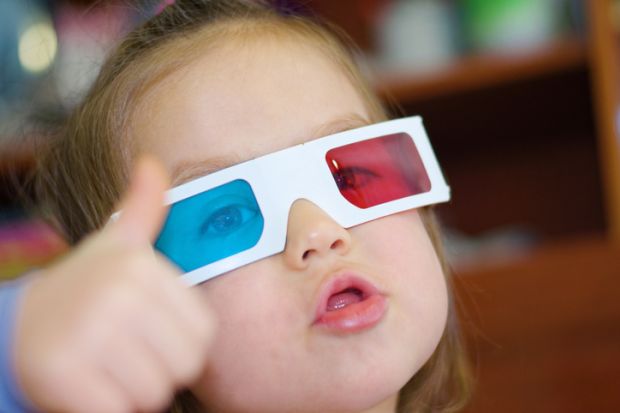 A child wears polarised 3D glasses