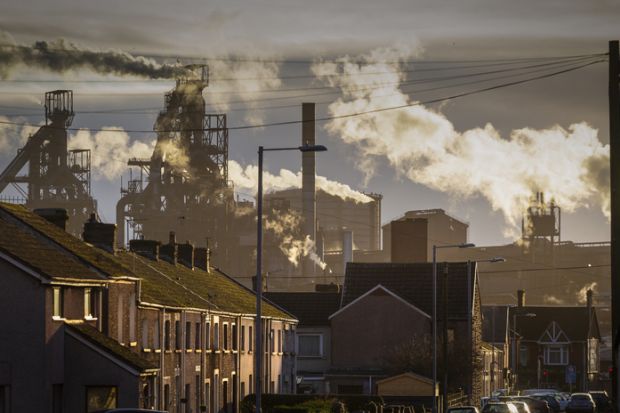 Houses in front of a steelworks in Port Talbot, symbolising local impact
