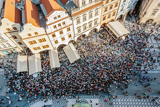 Aerial view of crowd in a square in Prague, Czech Republic to illustrate increasing international student mobility in Europe Aerial view of crowd in a square in Prague, Czech Republic to illustrate increasing international student mobility in Europe