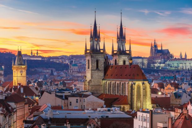 View over Church of Our Lady before Tyn, Old Town and Prague Castle at sunset