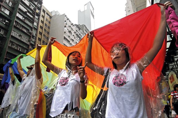 Demonstrators carry a giant rainbow flag in march against homophobia in Hong Kong, 2007