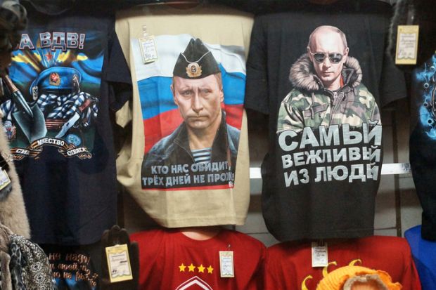 Russian president Vladimir Putin pictured on t-shirts in a Moscow shop