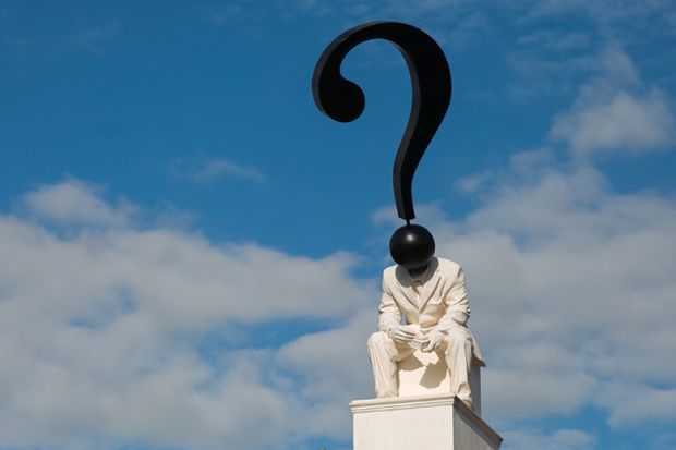Statue of figure with question mark as head